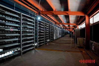A sprawling mining farm with rows of mining rigs humming under blue LED lights